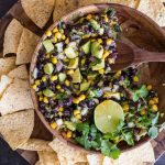 Quick and easy Avocado Dip! Everyone LOVES this fresh mix of avocado, black beans, and corn!