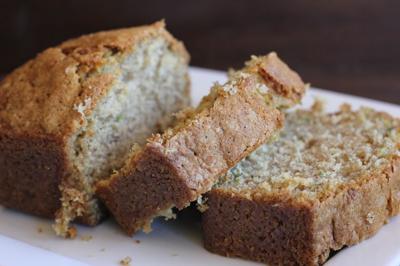 Zucchini Bread sliced on a plate.  