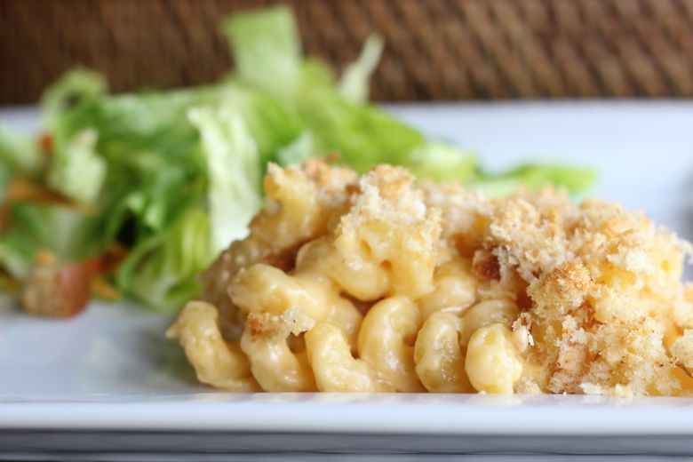Mac and Cheese with real breadcrumbs on a plate with a side salad.  