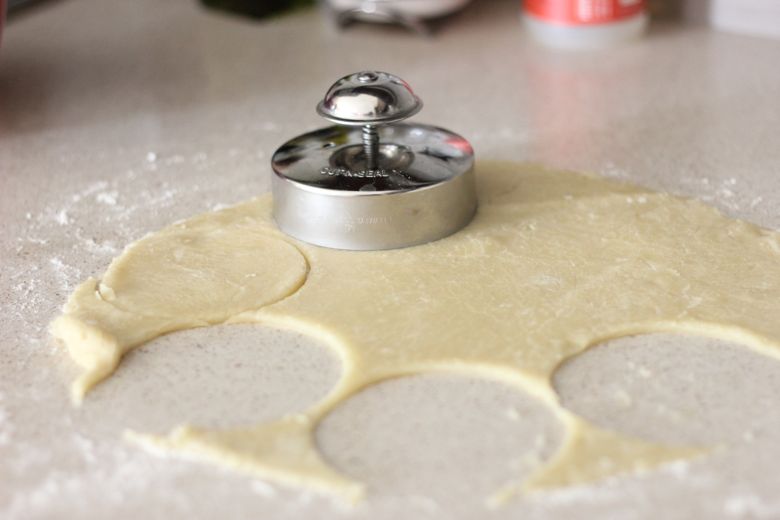 Peach Hand Pie crust dough being cut into circles.  
