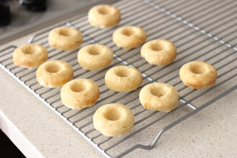 Sugar Cookie Donuts on a cooling rack.  