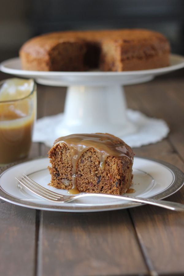 A slice of Applesauce Cake With Butterscotch Sauce on a plate with a fork.  