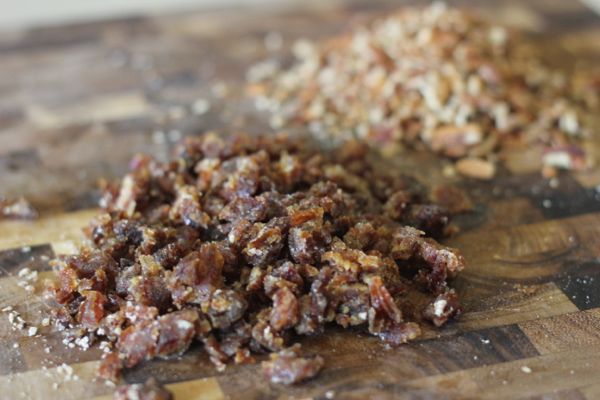 Chopped dates and chopped pecans on a cutting board.  