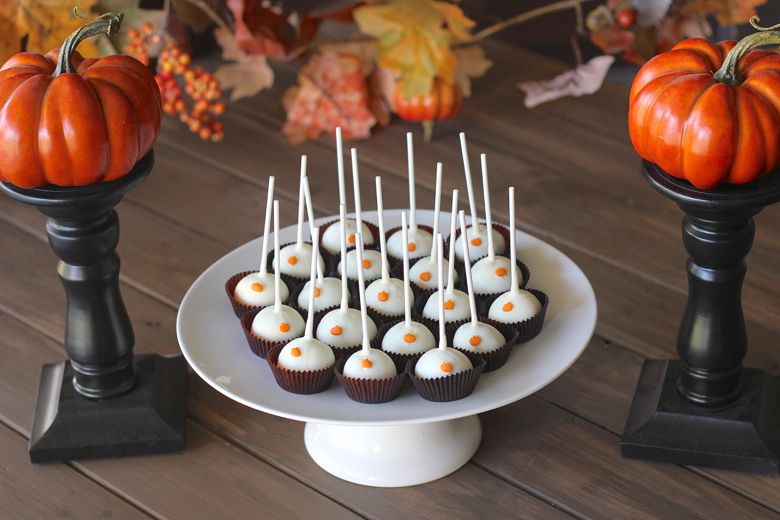 Pumpkin Pie Truffle Pops displayed on a cake stand.  