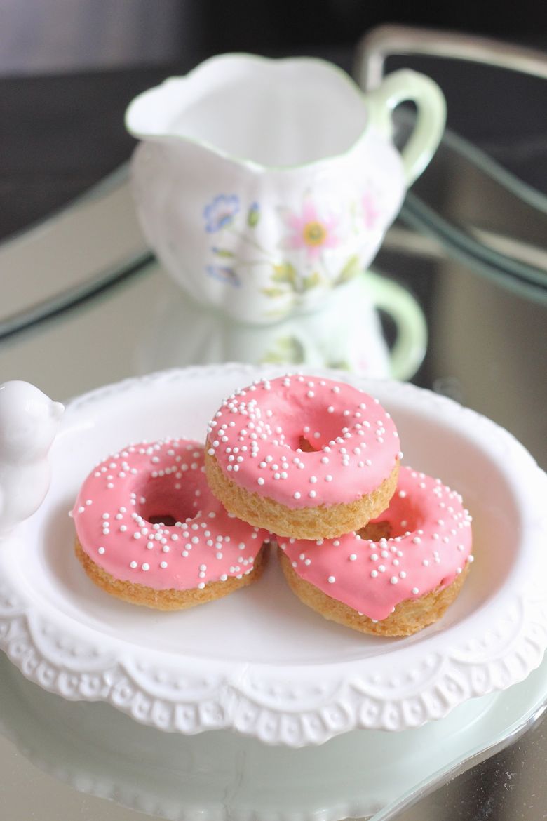 Sugar Cookie Donuts stacked on a plate.  