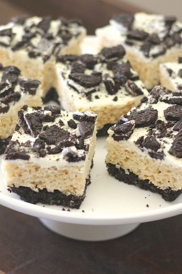 Cookies and Cream Rice Krispie Treats cut in squares on a serving stand.  