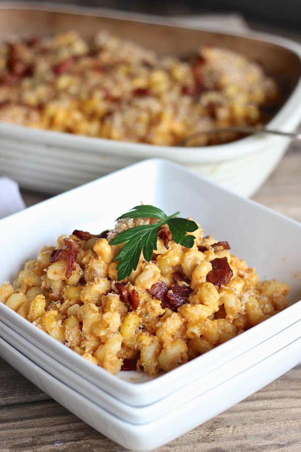 Pumpkin Mac and Cheese With Bacon in a bowl with garnish on top.  