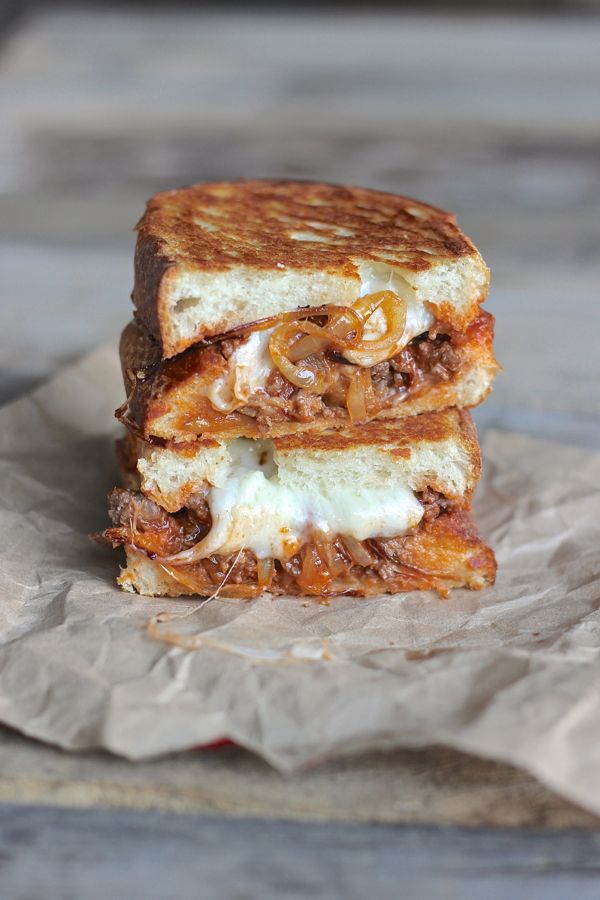 Sloppy Joe Panini With Baby Swiss and Caramelized Onions cut in half and stacked. 