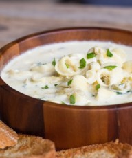 A creamy soup flavored with garlic, artichoke hearts, parmesan cheese, cream cheese, and cayenne pepper