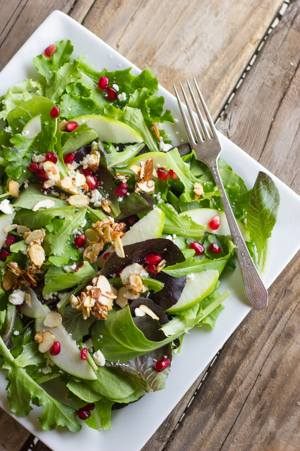 Harvest Salad With Cranberry Vinaigrette on a plate with a fork.  