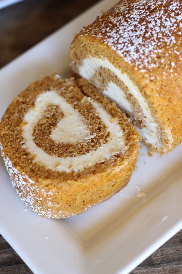 A top down view of a slice of pumpkin rolls showing the swirled filling. 
