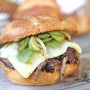 Crockpot Shredded Beef Sandwiches - juicy, tender shredded beef sandwiches with baby swiss cheese, sautéed peppers and onions on a buttery, toasted roll