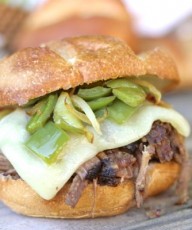 Crockpot Shredded Beef Sandwiches - juicy, tender shredded beef sandwiches with baby swiss cheese, sautéed peppers and onions on a buttery, toasted roll