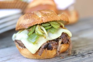 Crockpot Shredded Beef Sandwiches - juicy, tender shredded beef sandwiches with baby swiss cheese, sautéed peppers and onions on a buttery, toasted roll