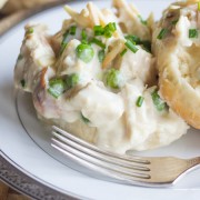 Chicken a la King - a creamy white sauce with chicken, peas and slivered almonds served over warm biscuits
