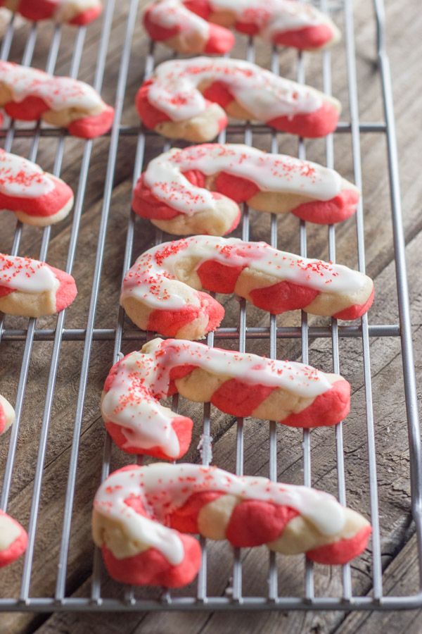 Iced Candy Cane Sugar Cookies on a cooling rack.  