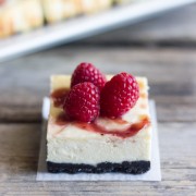 Cute little cheesecake bars with a raspberry swirl and an Oreo crust.