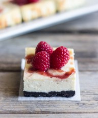 Cute little cheesecake bars with a raspberry swirl and an Oreo crust.