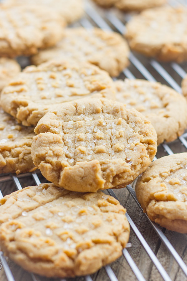 Brown Butter Peanut Butter Cookies stacked on a cooling rack.  