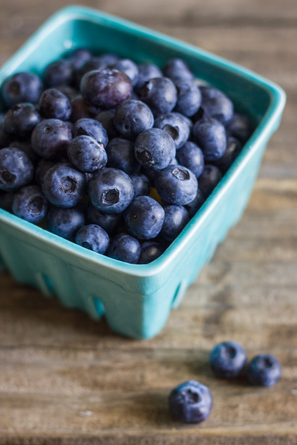 A carton of fresh blueberries.  