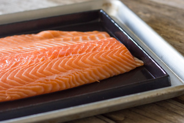 Salmon placed on the Silpat Entremet non-stick baking pan that is on an aluminum baking sheet.