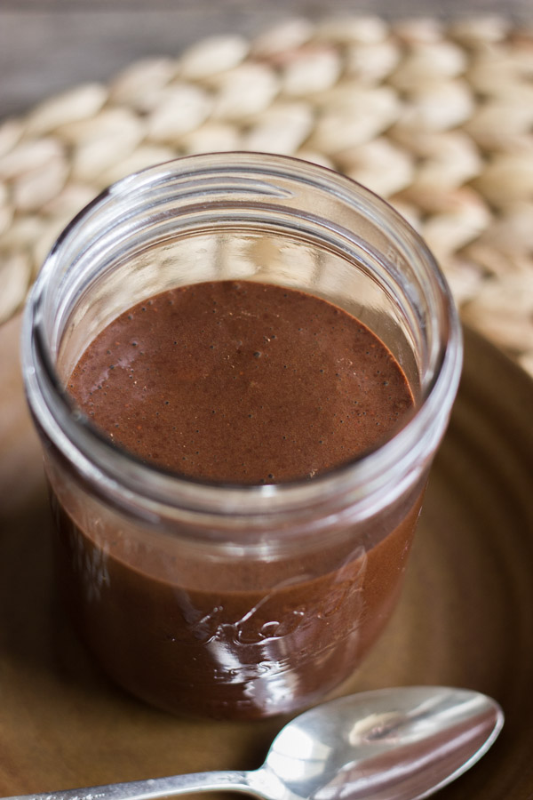 Two Ingredient All Natural Chocolate Syrup in a glass jar.  