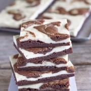 A thin layer of fudge brownies, followed by a layer of classic cheesecake and a brownie swirl.