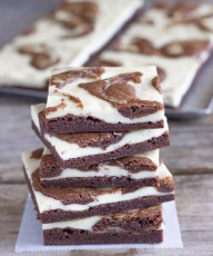 A thin layer of fudge brownies, followed by a layer of classic cheesecake and a brownie swirl.