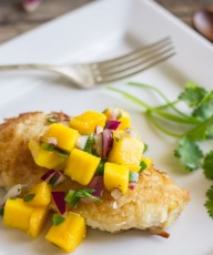 Chicken coated in a crispy coconut breading topped with a sweet and mildly spicy mango salsa.