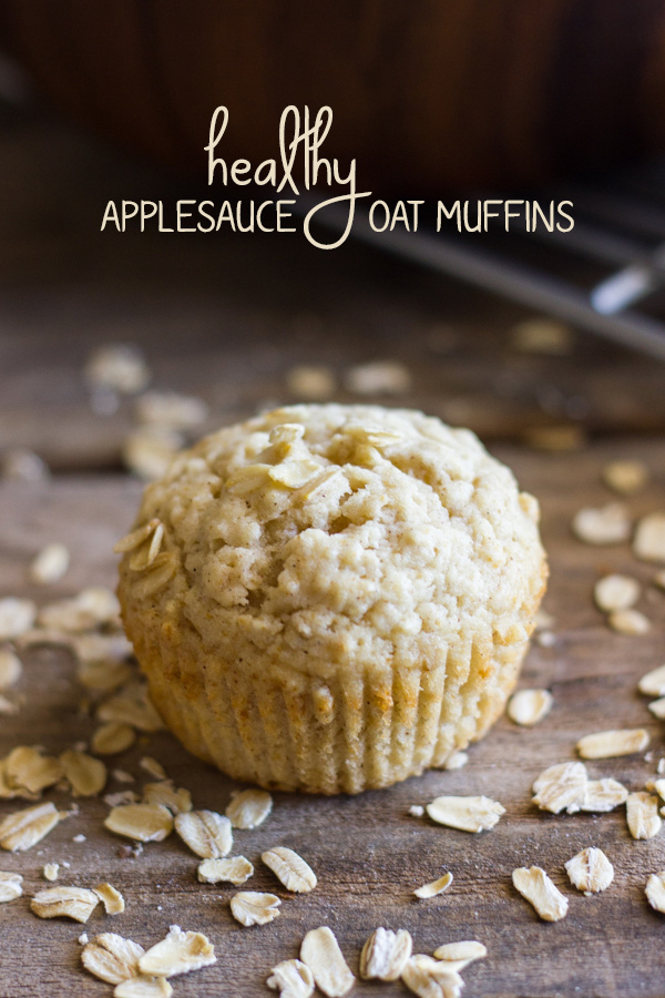 Healthy Applesauce Oat Muffin with oats sprinkled around it.  