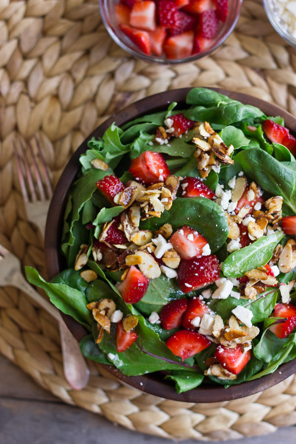 Strawberry and Spinach Salad with Almond Vinaigrette in a bowl.