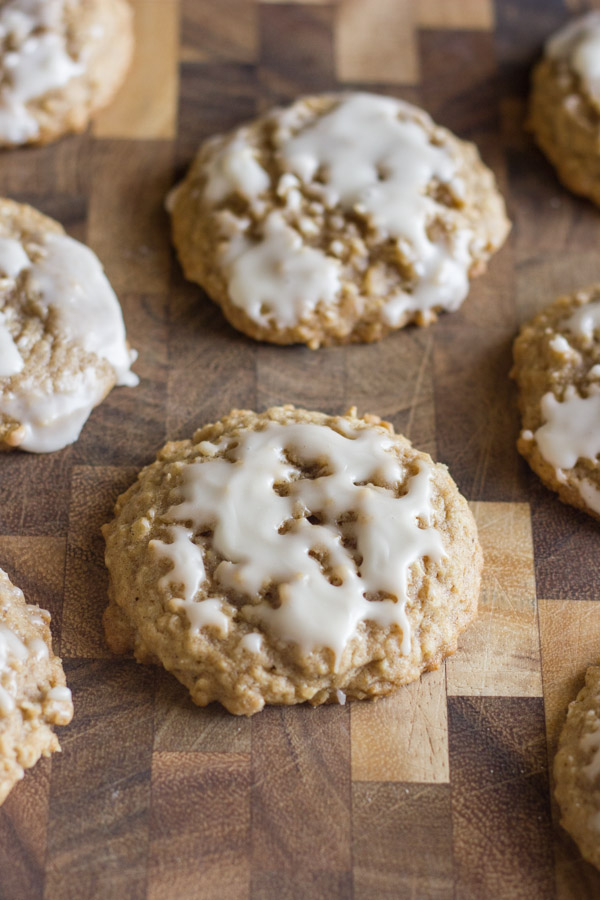 Maple Iced Oatmeal Cookies on a cutting board.  