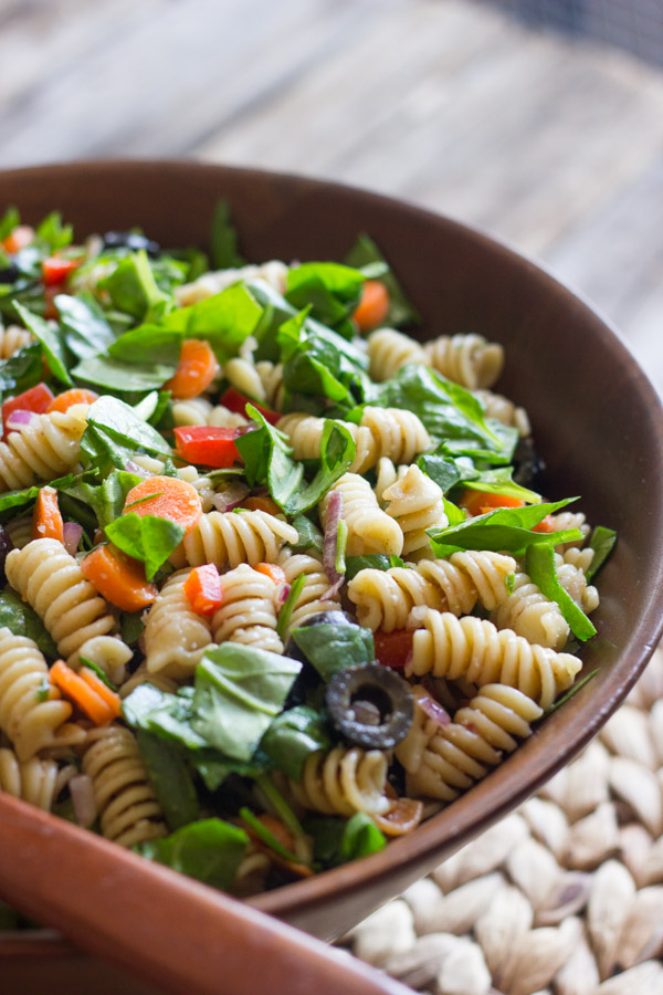 Chopped Spinach and Pasta Salad With Balsamic Vinaigrette in a large wooden bowl.