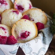 Healthier Raspberry Almond Muffins - tart raspberries tucked into a slightly sweet almond muffin, lightened up with the help of coconut oil and Greek yogurt!