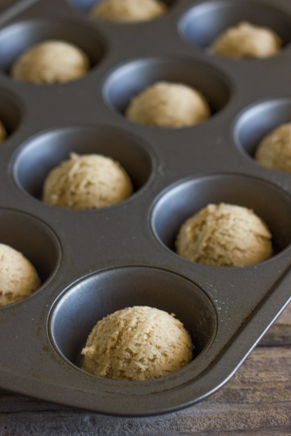 Dough balls for the Ice Cream Sundae Cookie Cups in a muffin tin.  
