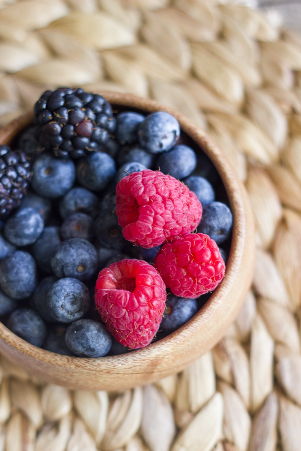 A bowl of blueberries, blackberries and raspberries.  