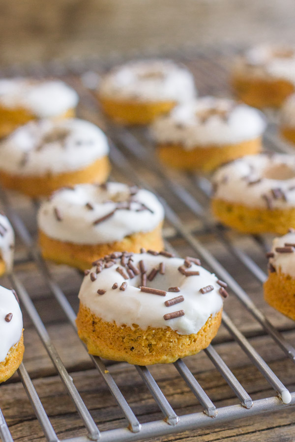 Mini Baked Pumpkin Chocolate Chip Donuts on a cooling rack.  