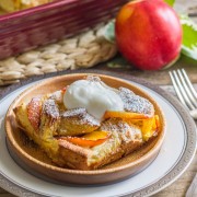 Peaches and Cream French Toast Bake - topped with juicy, ripe, peaches & homemade whipped cream