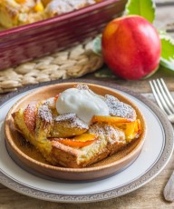 Peaches and Cream French Toast Bake - topped with juicy, ripe, peaches & homemade whipped cream