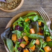 Roasted Sweet Potato Salad - roasted sweet potatoes, dried cranberries, and sunflower seeds on mixed baby greens.