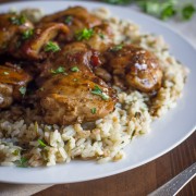 Creamy Balsamic Skillet Chicken - Rich, flavorful, boneless chicken thighs served over rice with a creamy balsamic sauce you'll love!