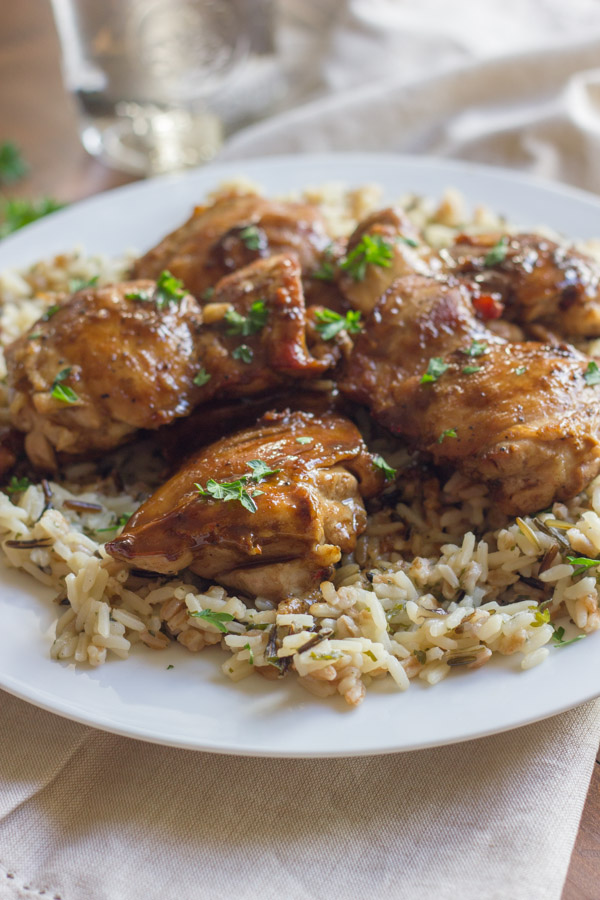 Creamy Balsamic Skillet Chicken served over rice on a plate.  