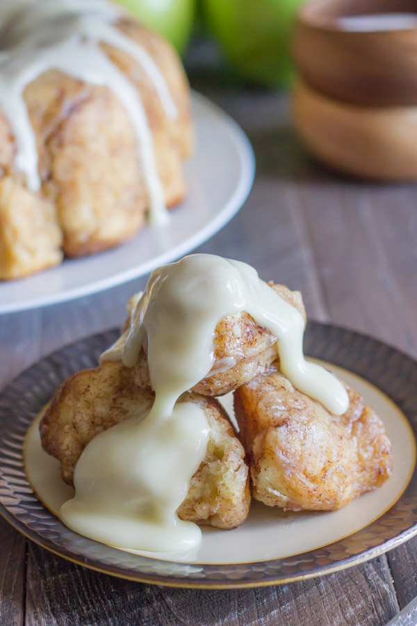 Apple Cinnamon Pull Apart Bread serving on a plate with Apple Cider Glaze on top.  
