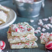 Butter Cracker Peppermint Bark - a thin layer of creamy white chocolate over a buttery, flakey cracker with soft peppermint candies on top.