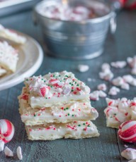 Butter Cracker Peppermint Bark - a thin layer of creamy white chocolate over a buttery, flakey cracker with soft peppermint candies on top.