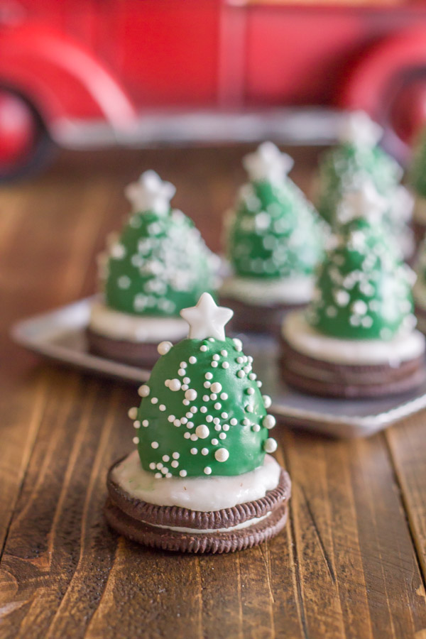 Chocolate Covered Strawberry Christmas Tree in front of a serving tray of more trees. 