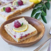 Raspberry Lemon Bars - fresh raspberries whisked into a sweet and tart lemon filling - all on top of a thick, buttery shortbread crust!