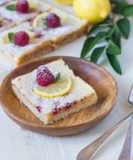 Raspberry Lemon Bars - fresh raspberries whisked into a sweet and tart lemon filling - all on top of a thick, buttery shortbread crust!