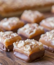 Homemade Caramel Almond Shortbread Bites - Tiny pieces of chocolate covered shortbread topped with the best ever homemade caramel and almonds!