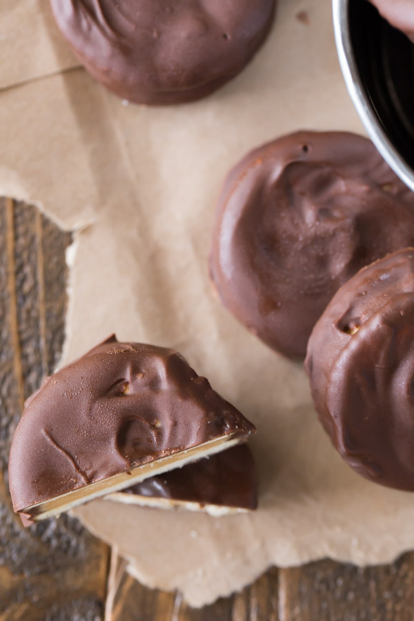 Peanut Butter Buckeye Cookie cut in half and stacked, with more whole cookies around it.  